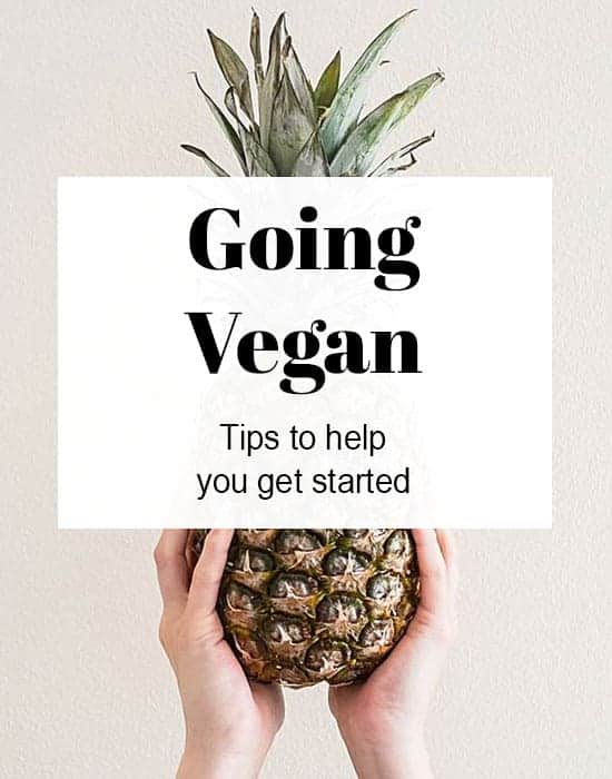 How to Go Vegan text with someone holding a pineapple in the background