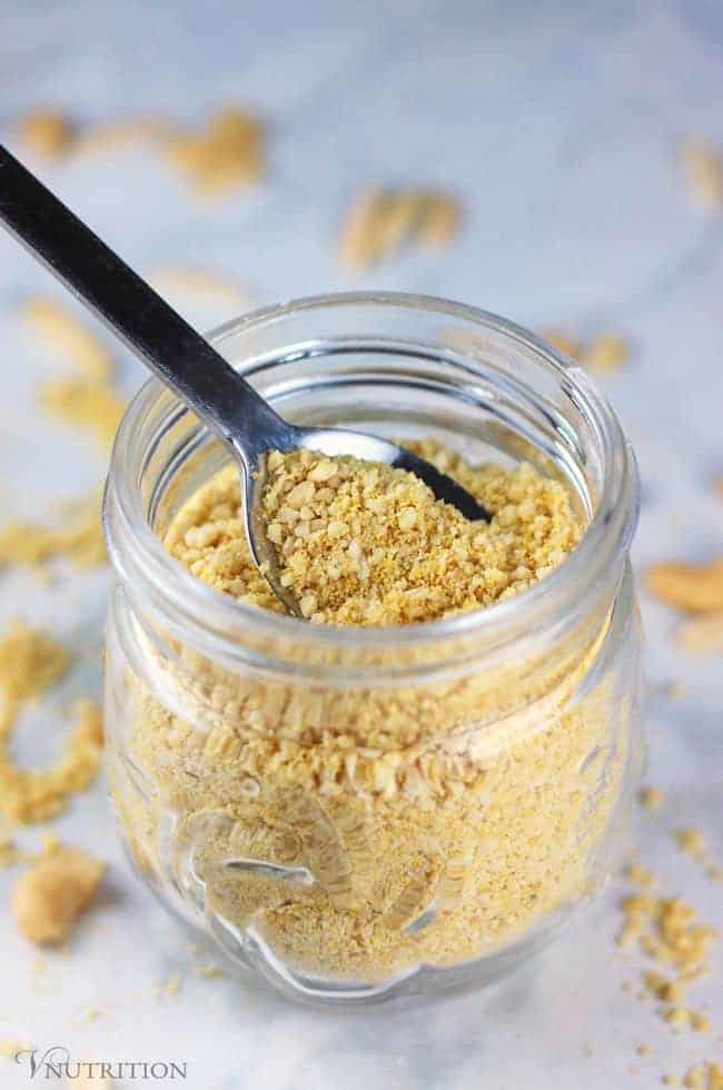 vegan parmesan in jar with spoon