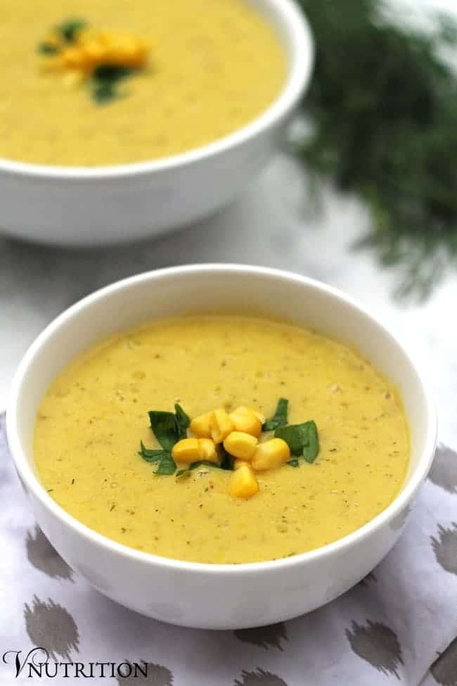 close up of a bowl of creamy vegan corn soup.