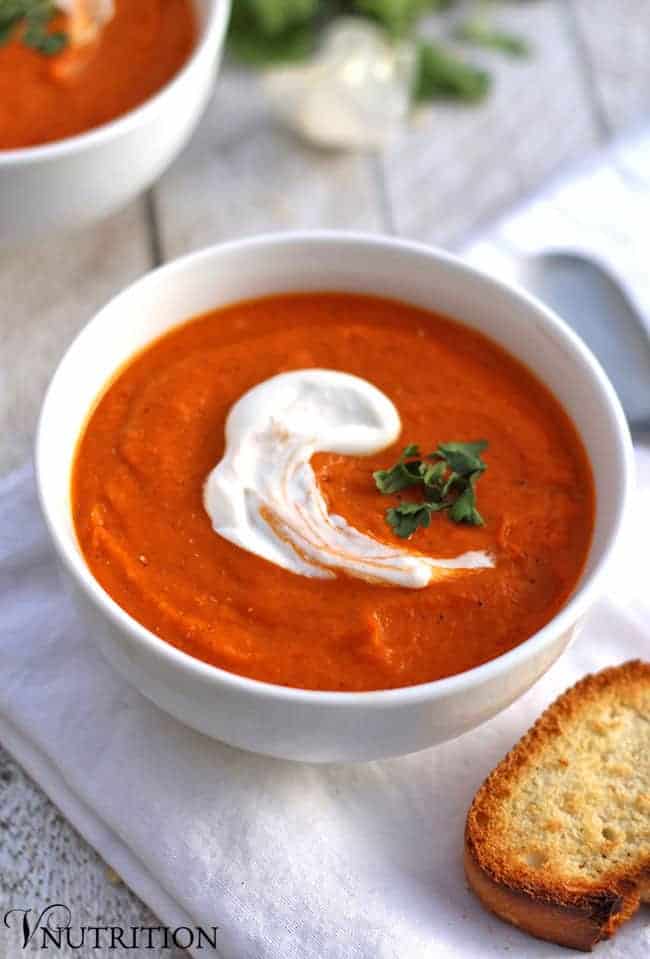 vegan Roasted Tomato Soup with sour cream on white napkin