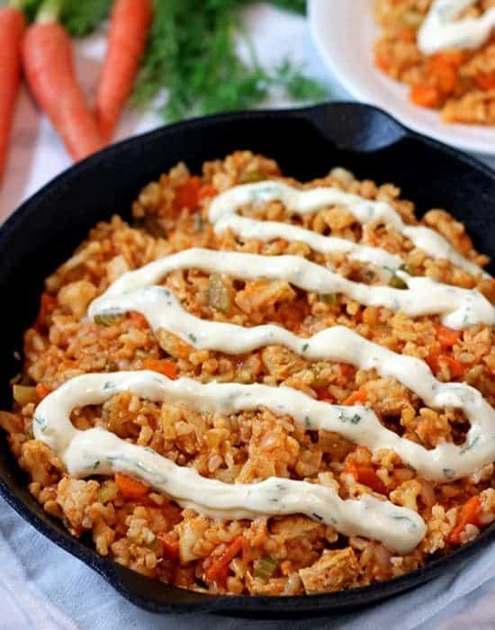 Vegan Buffalo Chicken Rice Skillet | This gluten free recipe comes together fast with vegan chicken, brown rice & veggies. Vegan buffalo dish makes a delicious and easy vegan meal that's perfect for football season or the Super Bowl. Vegan Buffalo Chicken Rice Skillet