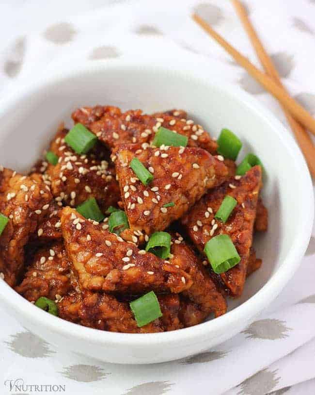 teriyaki tempeh with napkin and chopsticks in background