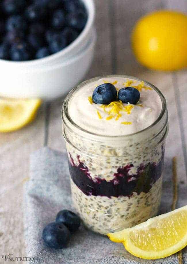 8 oz mason jar of layered Blueberry Lemon Cheesecake Overnight Oats.