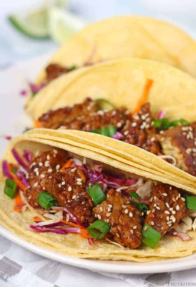 close up of tempeh tacos to show the teriyaki tempeh and asian slaw.