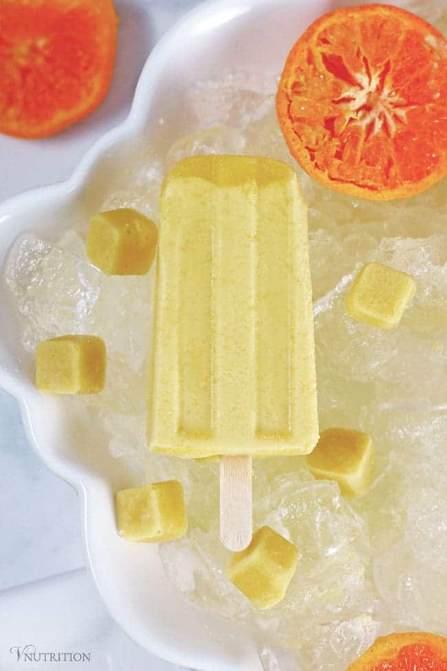 Ginger Orange Creamsicle Pop | These Ginger Orange Creamsicle Pops are a easy healthy treat! Similar to store-bought creamsicles, these dairy-free pops are full of creamy goodness from coconut milk and elevated with the taste of ginger. Ginger Orange Creamsicle Pop