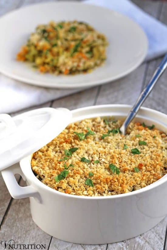 healthy vegetable Casserole for Thanksgiving in a white oblong casserole dish with a lid