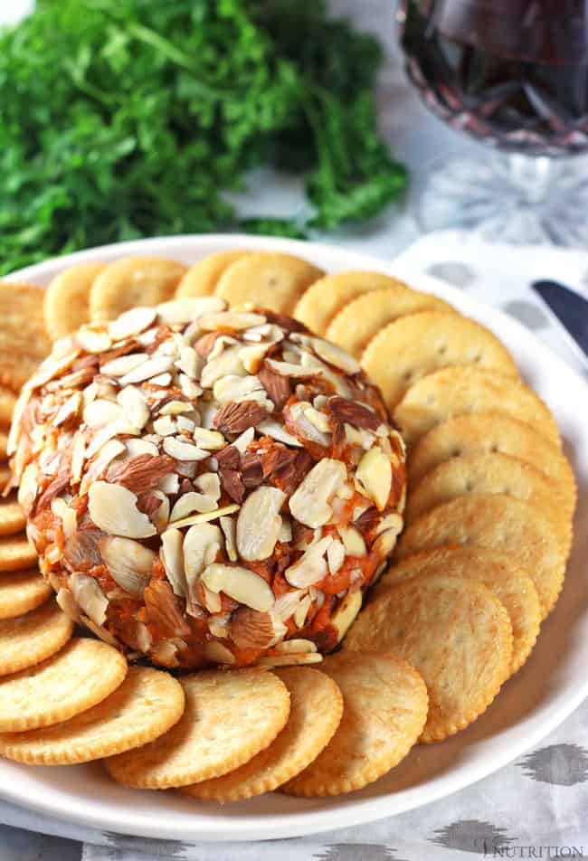 vegan port wine cheese surrounded with vegan butter crackers.