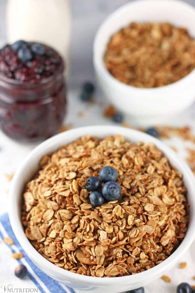 Healthy Granola | Are you looking for a healthy granola that is not filled with sugar? This Healthy Granola is a perfect addition to any breakfast or great as a snack on its own. It's gluten-free and refined sugar-free but still totally delicious! Throw it on yogurt or a smoothie bowl for some crunch or use it on its own as a cereal. gluten-free, dairy-free, vegan recipe, vegetarian, granola recipe, healthy granola recipe closeup of healthy granola