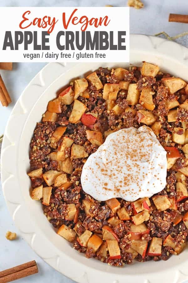 Easy Vegan Apple Crumble | This Vegan Apple Crumble is full of of whole foods and tastes amazingly delicious. Apples, cinnamon, nuts, and dates are topped with coconut cream to make a comforting dessert that is really easy to make. This crumble is gluten-free, dairy-free and full of flavor! It's the perfect healthy treat. #veganapplecrumble #vegancrumblerecipe #easyvegandessert #vnutrition #applecrumble
