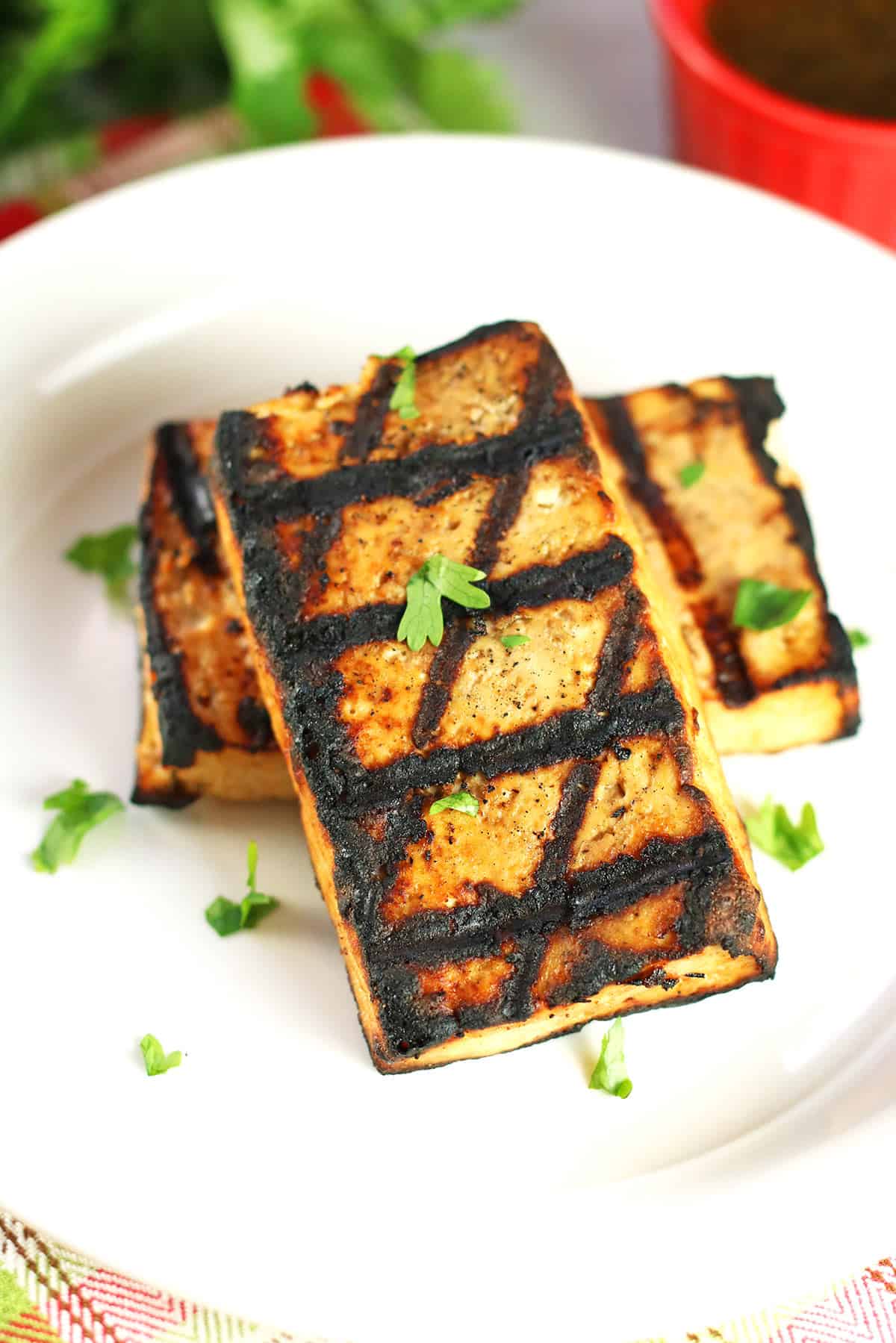 close up of grilled tofu steak showing cross-hatching from the grill.