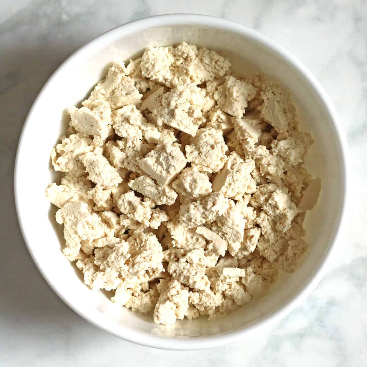 crumbled tofu in white bowl