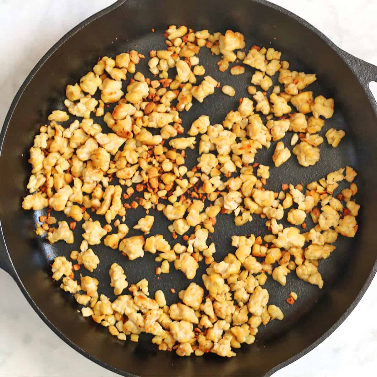 tempeh frying for meatless crumble recipe.