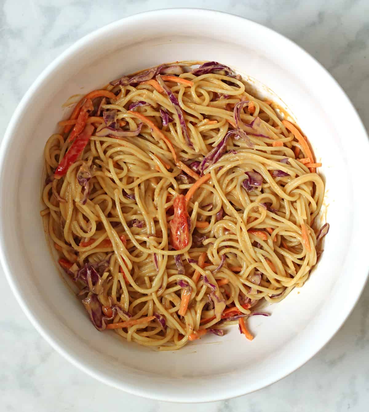 pasta and veggies in sauce.
