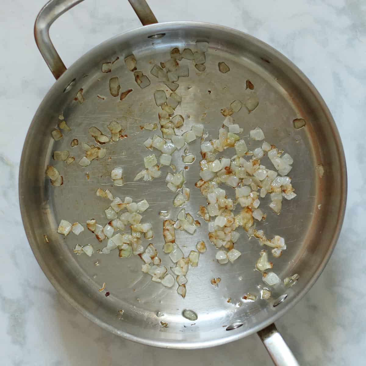 cooking onions in pan.