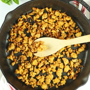 tempeh crumbles in a cast iron pan