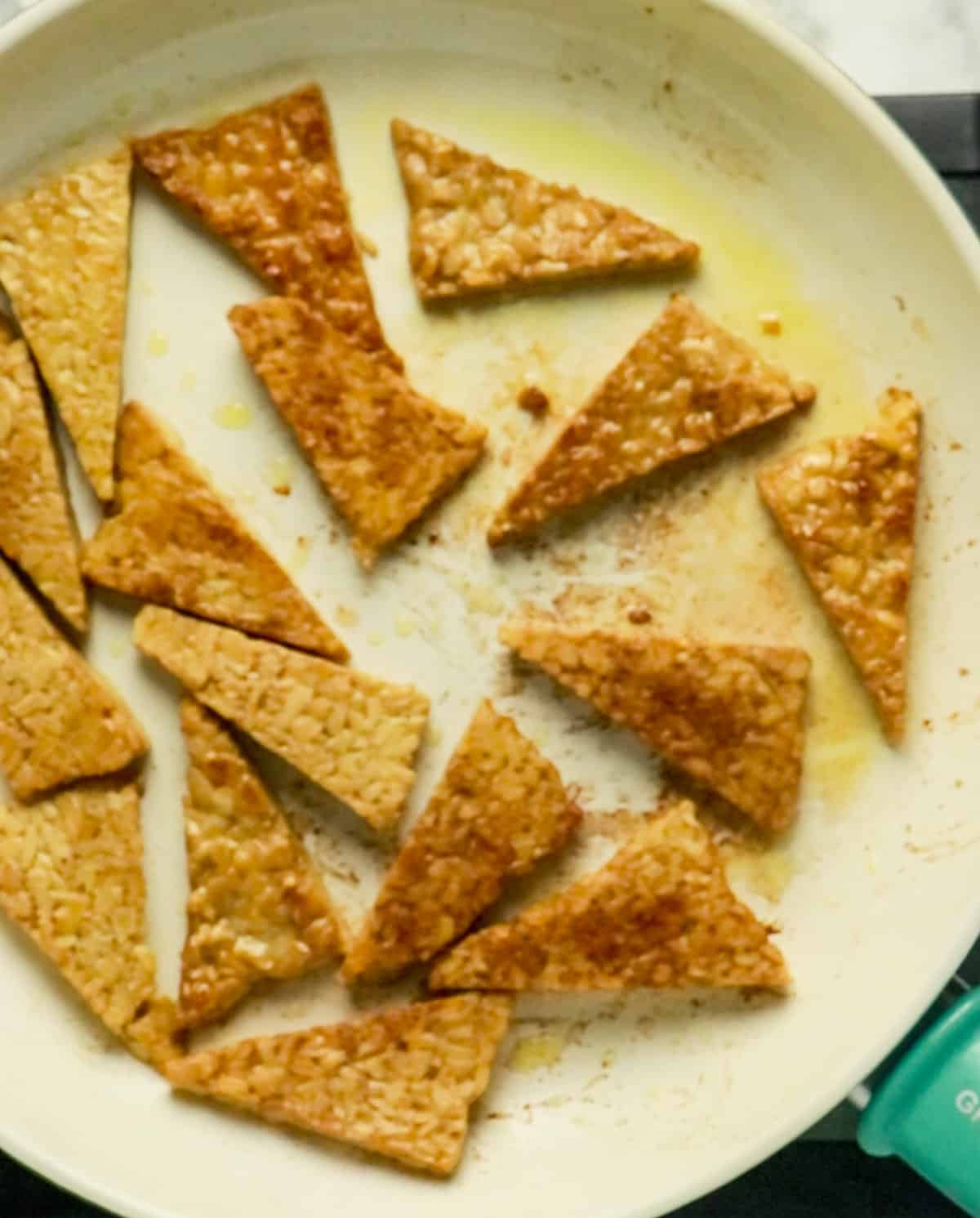 frying tempeh in pan with oil
