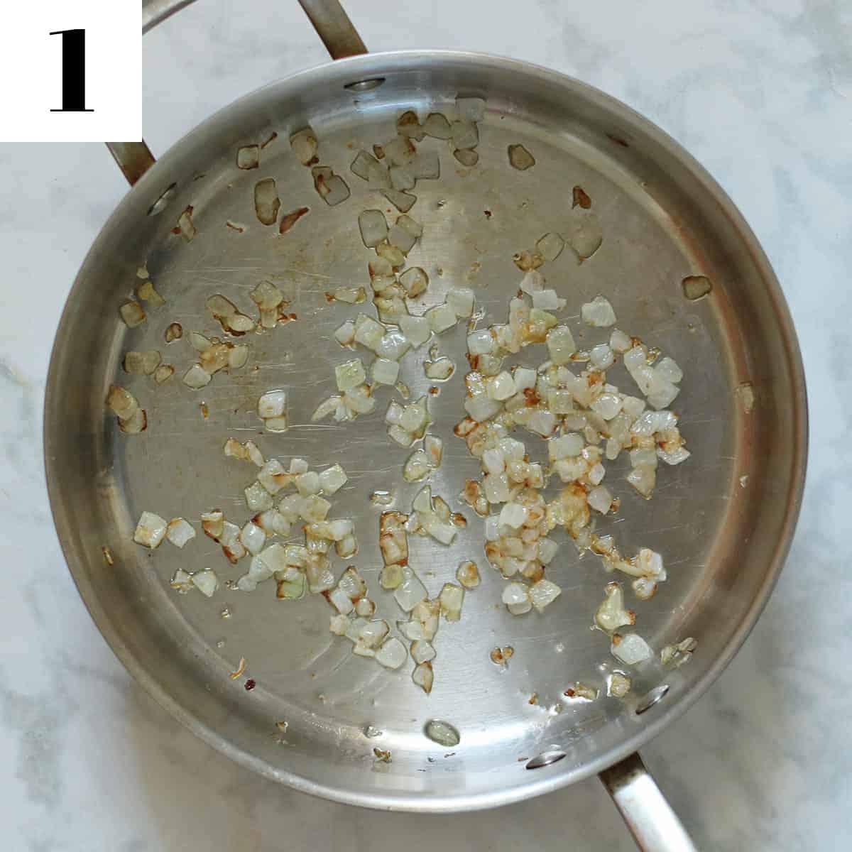 sautéing onions and garlic in stainless steel sauté pan.