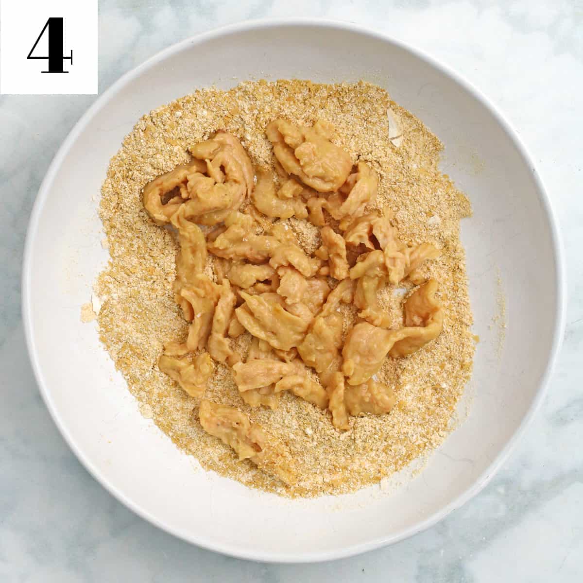 soy curls and breading in a white bowl