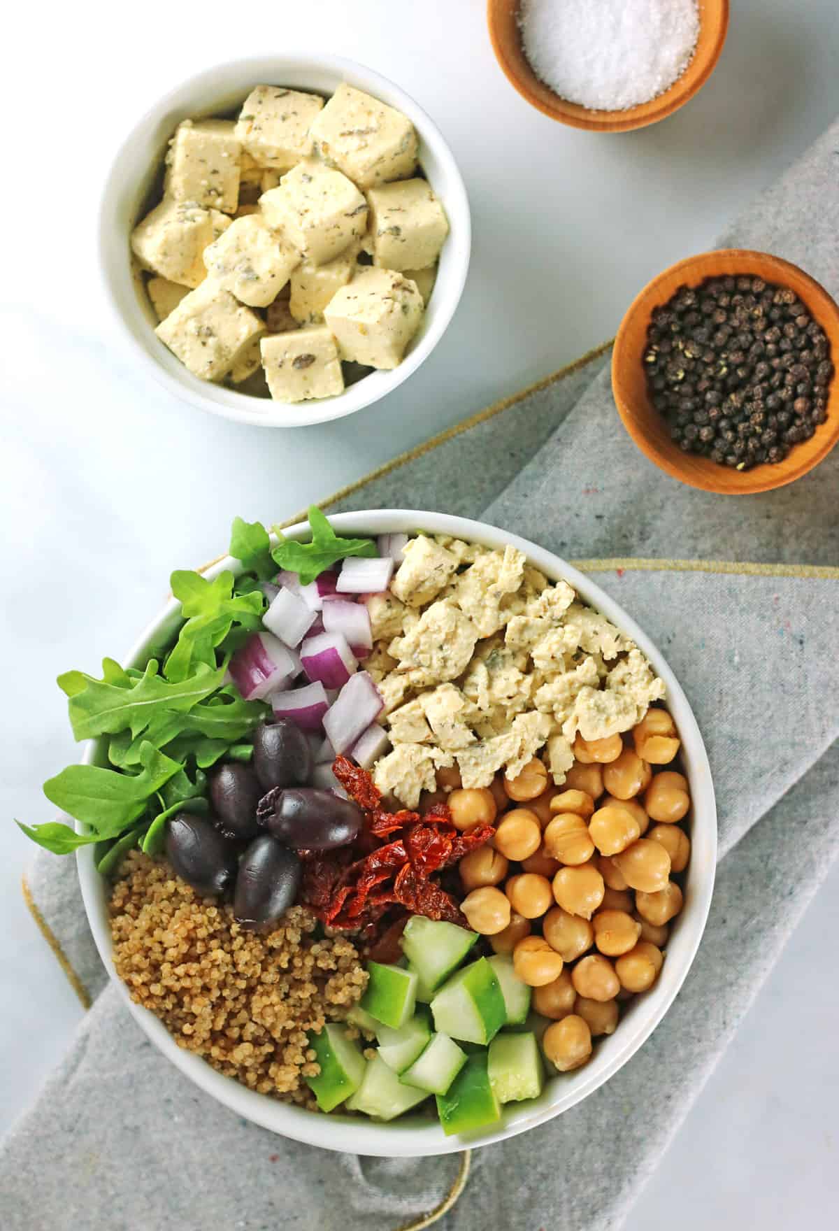 mediterranean greek quinoa salad with tofu feta and black peppercorns