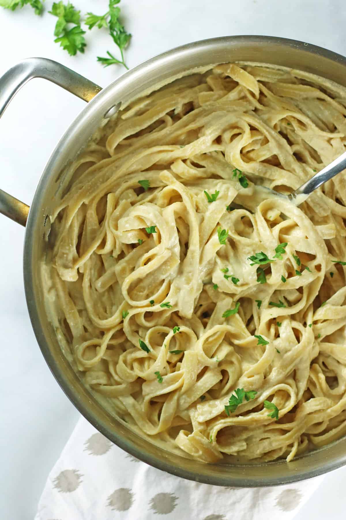 creamy vegan alfredo sauce in pan 