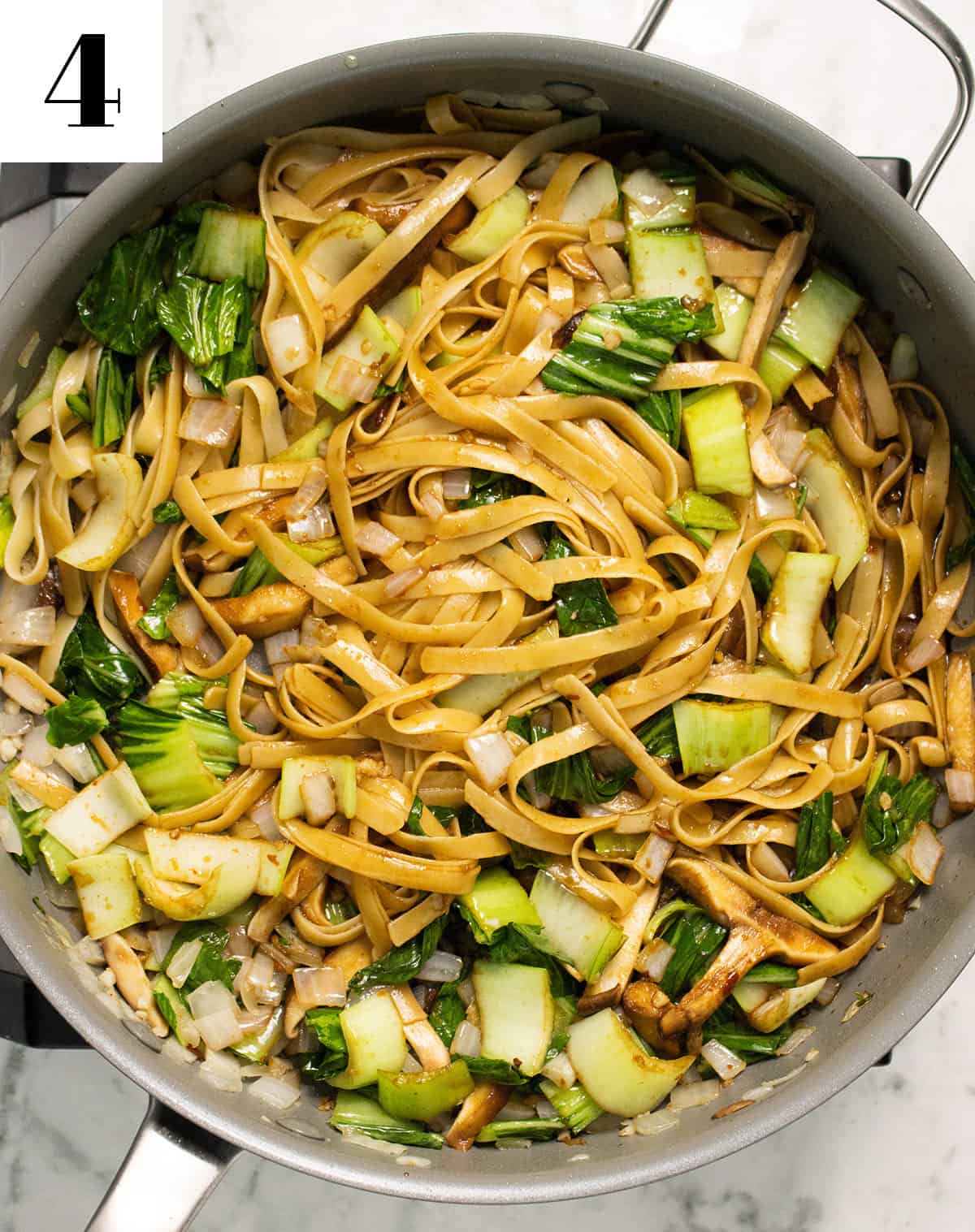 noodles added to pan with veggies