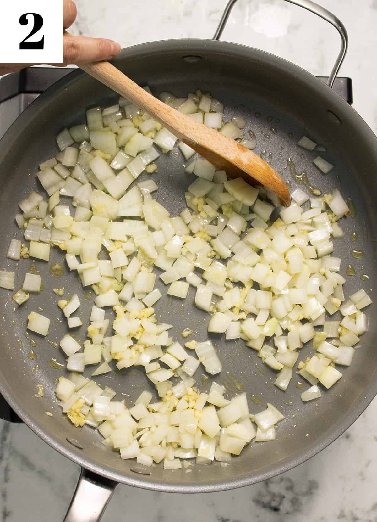 cooking onions and garlic in pan