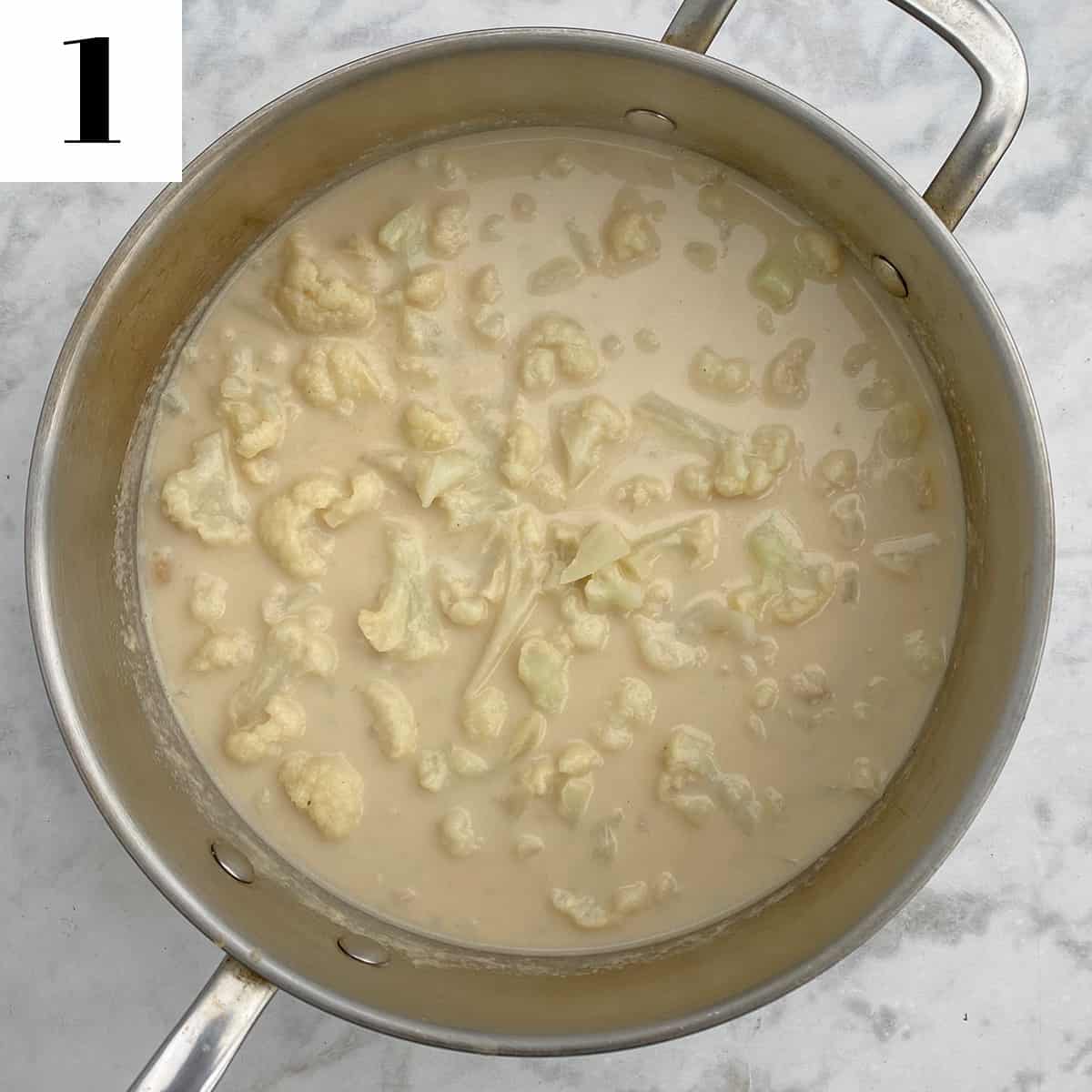 cauliflower cooking in large pan.