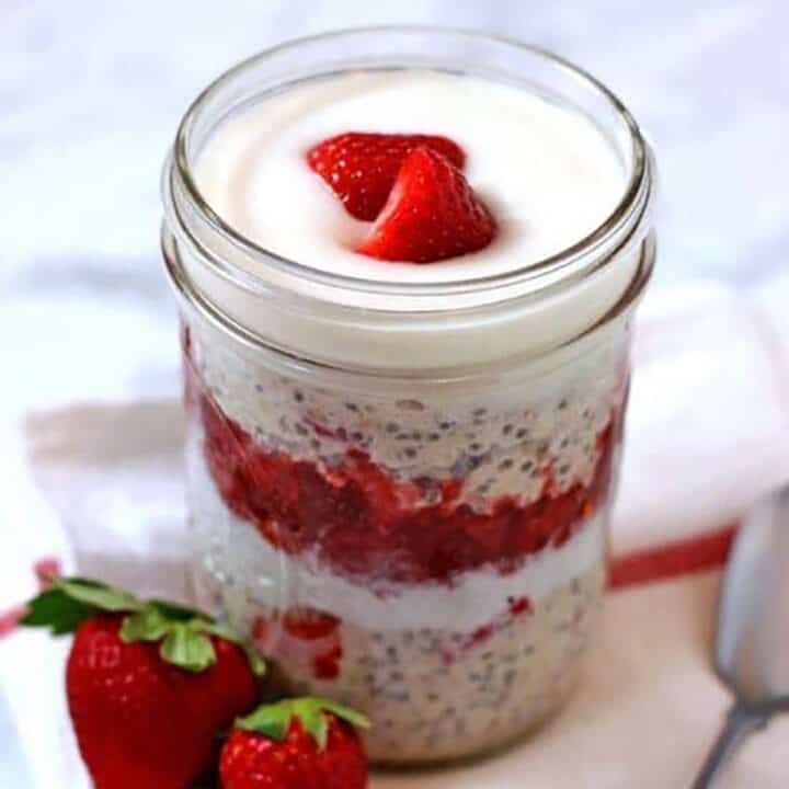 Strawberry overnight oats in glass jar.